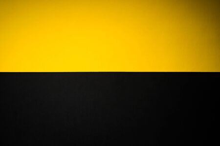 Black and yellow abstract divided backgroundの写真素材