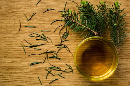 Pine needle tea on a wooden backgroundの写真素材