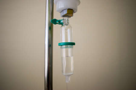 Medical Hanged Infusion Serum Dropper Close up in Hospital Roomの写真素材