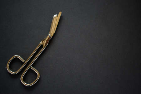 First aid kit scissors on black backgroundの写真素材