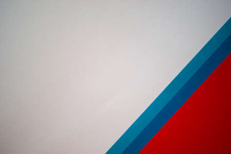 Geometric white, red and blue colored paper backgroundの写真素材