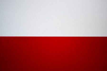 White and red background divided horizontally. Blank colored paper backgroundの写真素材