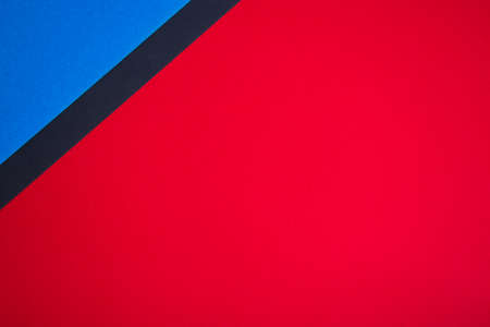Red, blue and black colored paper abstract background