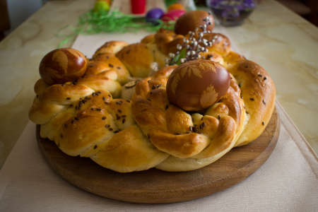 Handmade braided bread with Easter eggsの写真素材