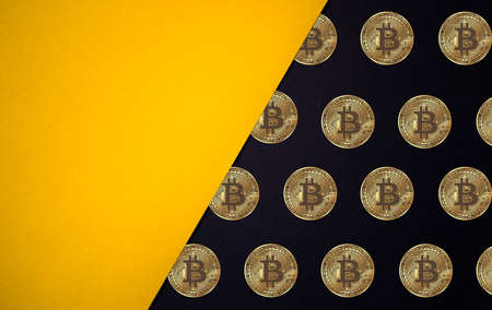 Bitcoin cryptocurrency black and yellow background with copy spaceの写真素材
