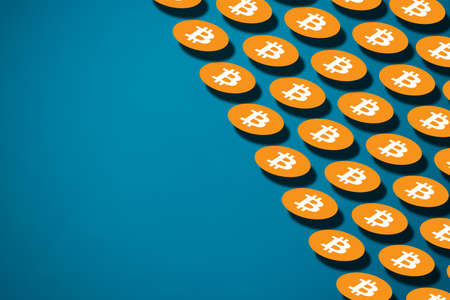 Bitcoin pattern on blue background with copy spaceの写真素材