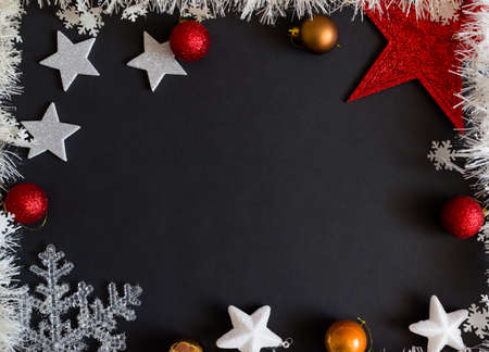 Christmas decorations on black background. Christmas blank greeting card, templateの写真素材