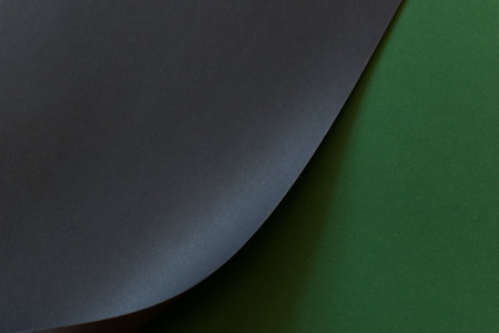 Green and black folded paper backgroundの写真素材