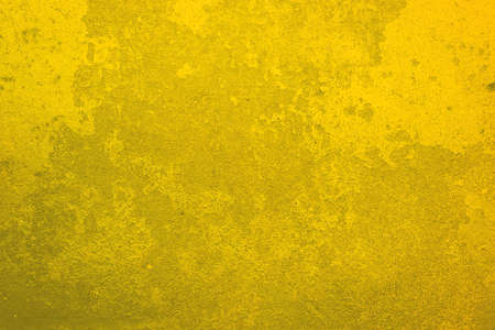 Yellow old grunge wall backgroundの写真素材