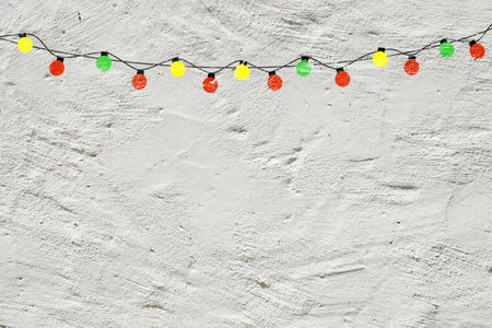 Decorative light bulbs on white wall, copy spaceの写真素材