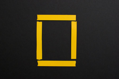 Yellow square frame on black background