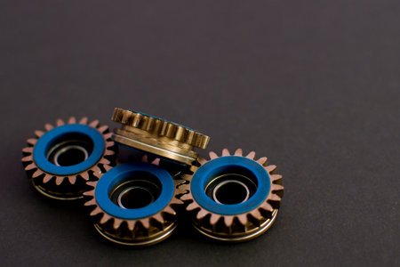 Metal gears on black background, copy space
