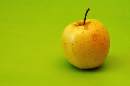 Apple on green backgroundの写真素材