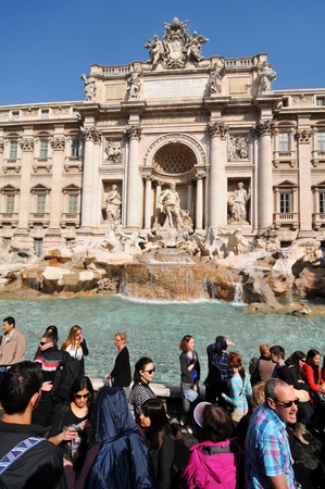 Rome, Italy - 30 March, 2012: Tourists thinking their wishes and throwing coins in the famous Fontana di Trevi, one of the most famous fountains in the world.のeditorial素材