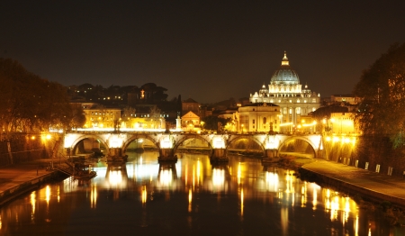 Rome, Italy - 29 March, 2012: Night view of bridge in Rome with San Pietro basilica in the backgroundのeditorial素材