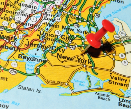 London, UK - 13 June, 2012: New York city marked with red pushpin on US map. New York is the most populous city in the worldのeditorial素材