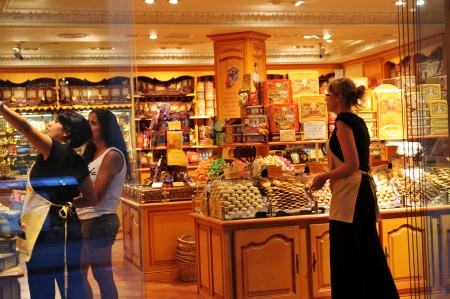 Barcelona, Spain - 6 July, 2012: Tourists shopping in sweets shop on La Rambla, major commercial area in the Spanish capital cityのeditorial素材