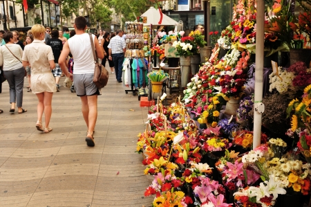 Barcelona, Spain - July 08, 2012: Crowds of tourists shopping in La Ramblas, major commercial area in the centre of Barcelonaのeditorial素材