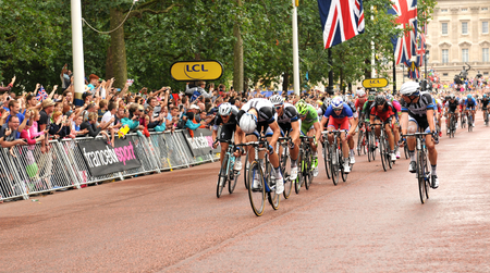 London, UK - July 7, 2014 Cyclists arrive at The Mall, approaching the finish line of the third stage of the Tour de France のeditorial素材