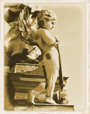 Vintage postcard depicting old statue of angelの写真素材