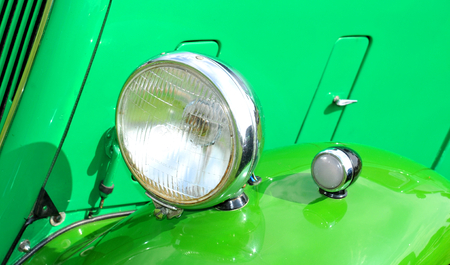 Detail of light of green vintage carの写真素材