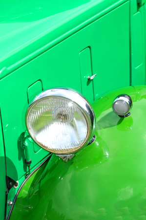 Detail of light of green vintage carの写真素材