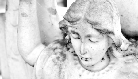 Close up of stone angel in the cemeteryの写真素材