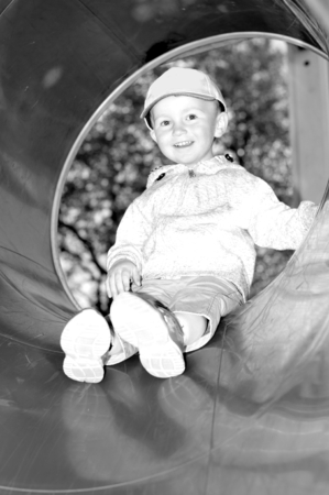 Portrait of a happy child on a slideの写真素材