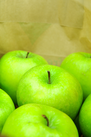Close up of green apples in shopping bagの写真素材