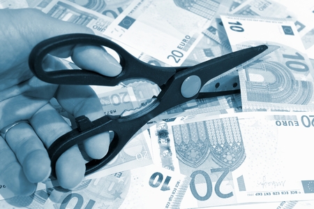 Budget cut concept with scissors and eurosの写真素材