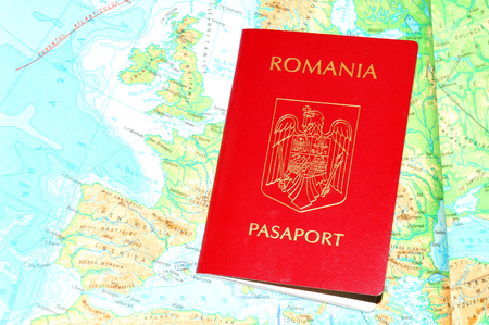 Romanian passport with currency on Europe mapの写真素材
