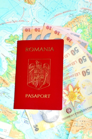 Romanian passport with currency on Europe mapの写真素材