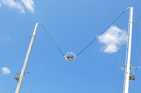 Paris, France - July 9, 2015: People are having fun in reverse bungee jumping in amusement park by...