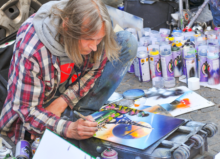 Paris, France - July 9, 2015: Street artist works on graffiti by the Pompidou Centre in central Parisのeditorial素材