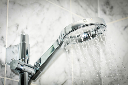 Detail of modern shower with water pouringの写真素材