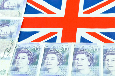 British pound concept  with currency and UK flag