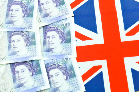 British pound concept  with currency and UK flagのeditorial素材