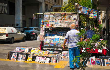 Athens, Greece - June 14, 2017: Street vendor sells newspapers in Syntagma Square in Athens, Greeceのeditorial素材