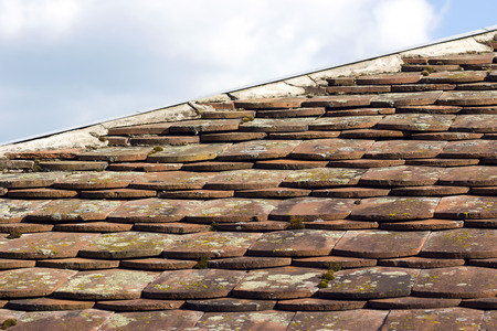 Old mossy tiled roofの写真素材