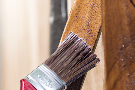 mahogany planks painting with a brushの写真素材