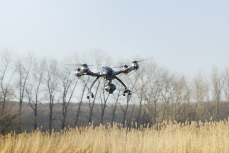 drone with a camera over a pond