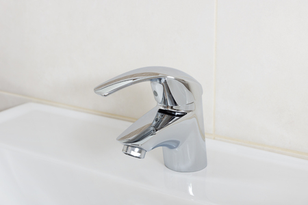 new faucet in the bathroomの写真素材