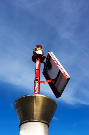 small lighthouse with red bulbの写真素材