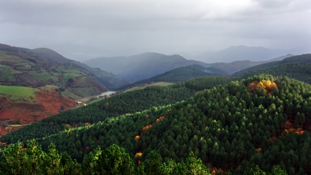 typical basque landscape with mountains in rainy dayの写真素材