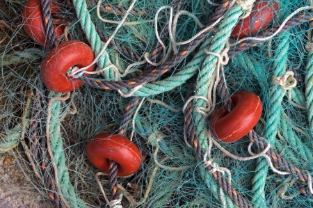fishing corks in fishing net and a ropeの写真素材