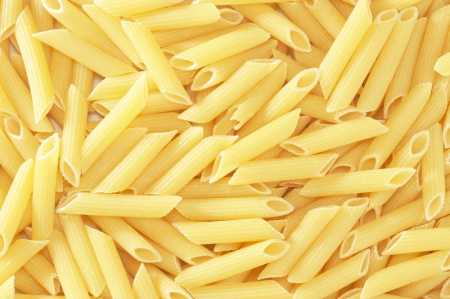 background with closeup of macaroni pastaの写真素材