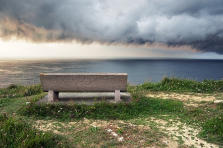 seat near sea with storm comingの写真素材