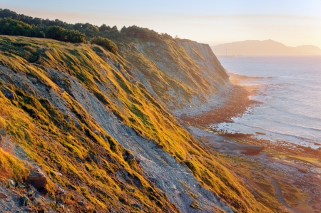 Cliffs of Azkorri beach at sunset. Getxo, Basque Country, Spain