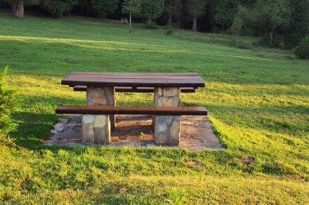 picnic table on countryside with sun raysの写真素材