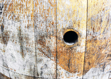 old wine barrel with a hole